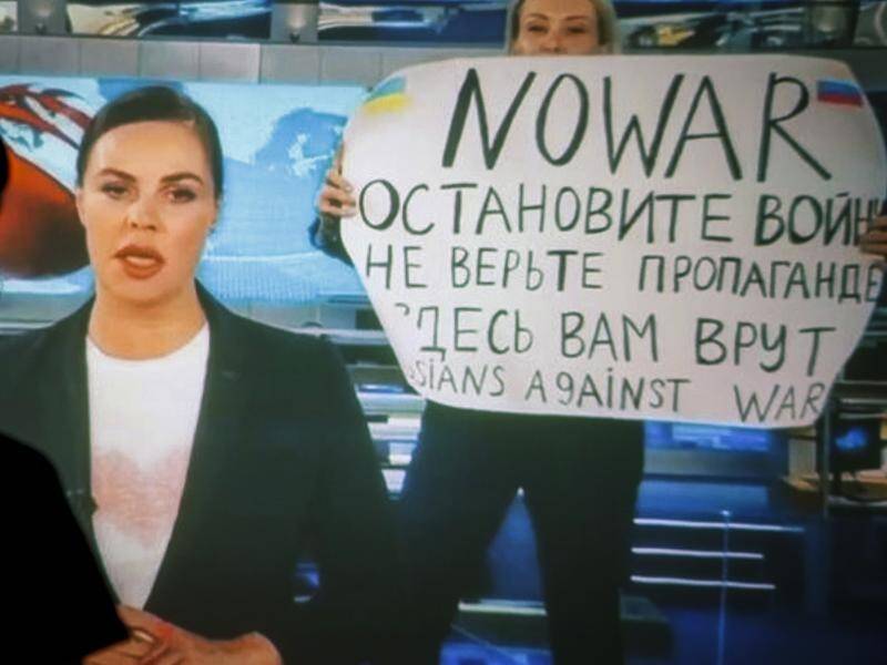 Marina Ovsyannikova (right) has been fined after disrupting Channel One's news broadcast.