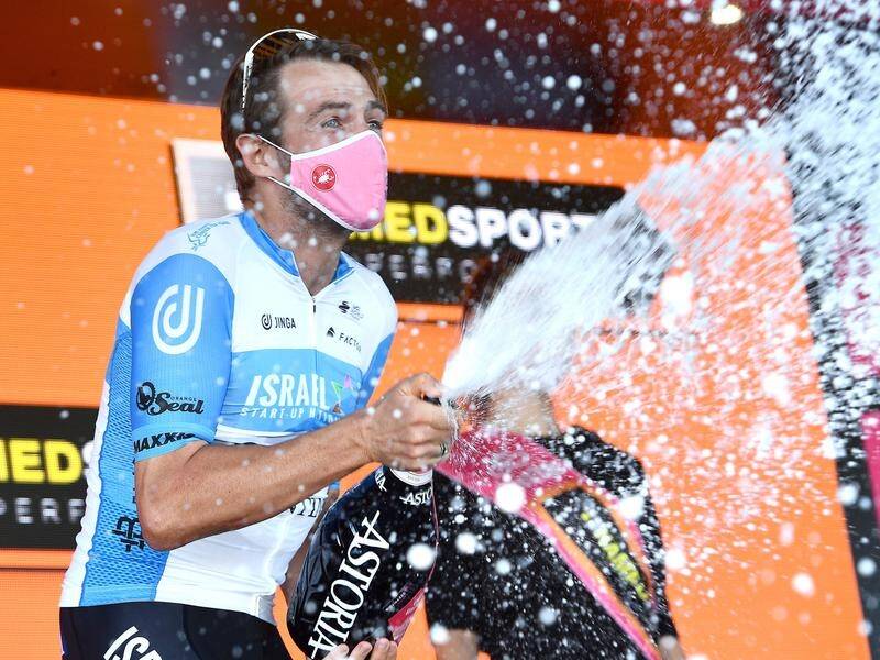 Britain's Alex Dowsett celebrates with the bubbly after winning stage eight at the Giro d'Italia.