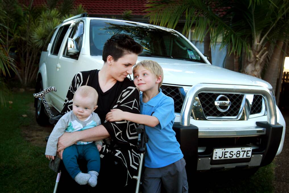 Overwhelmed: Oak Flats mother Jessie Bruton, with Klay and Levi, was overwhelmed when someone gave her a modified car to help her after she suffered severe nerve damage during her last pregnancy. Picture: SYLVIA LIBER
