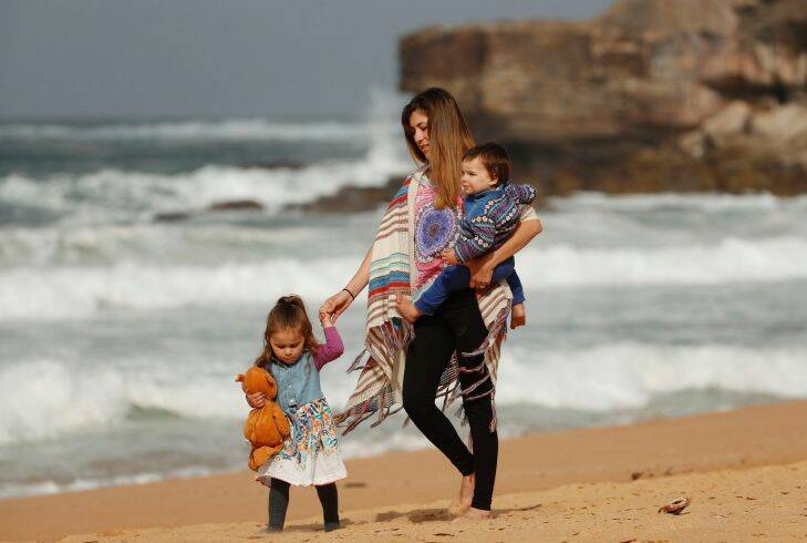 Marian Russell walks with her two children Allegra and Bodie at Warriewood beach on August 31,  2017 in Sydney, Australia.  (Photo by Daniel Munoz/Fairfax Media)