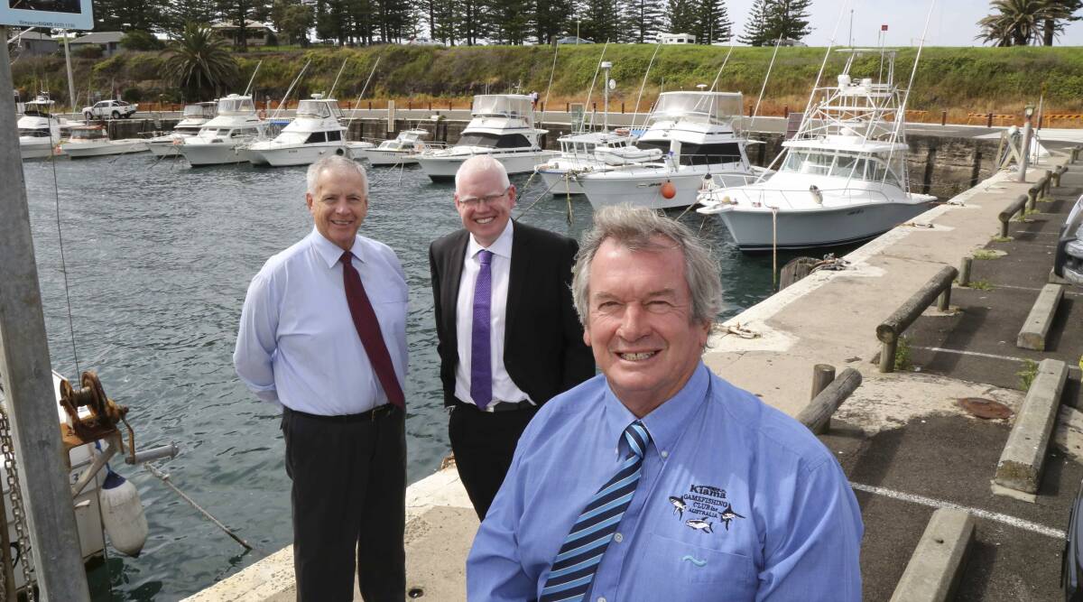 Eye on tourism: Kiama councillor Mark Way (left), Kiama MP Gareth Ward and mayor Brian Petschler at Kiama Harbour, discussing the possibility of attracting cruise liners. Picture: GEORGIA MATTS
