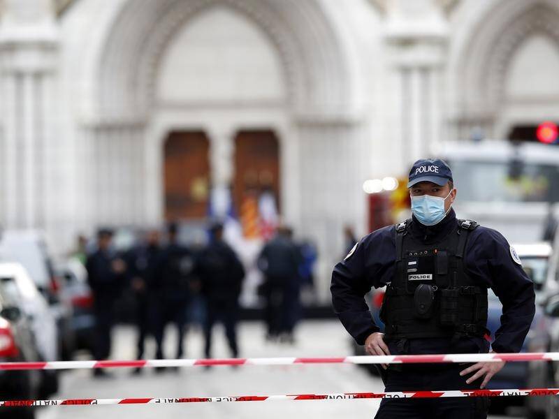 Police armed with automatic weapons set up a cordon around the Notre Dame Basilica church.