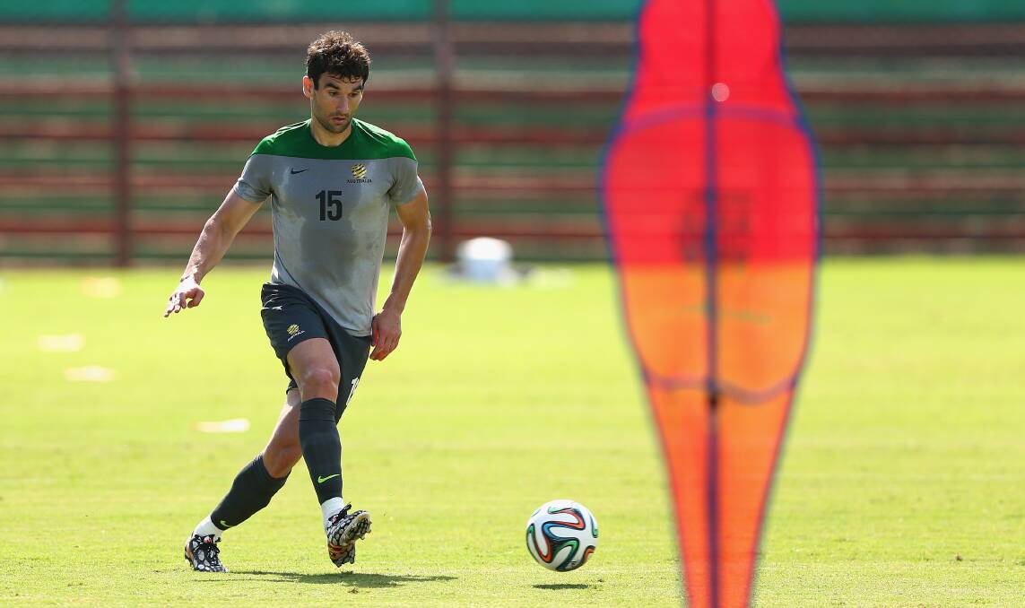 Socceroos captain Mile Jedinak kicks during an Australian training session in Vitoria. Picture: GETTY IMAGES