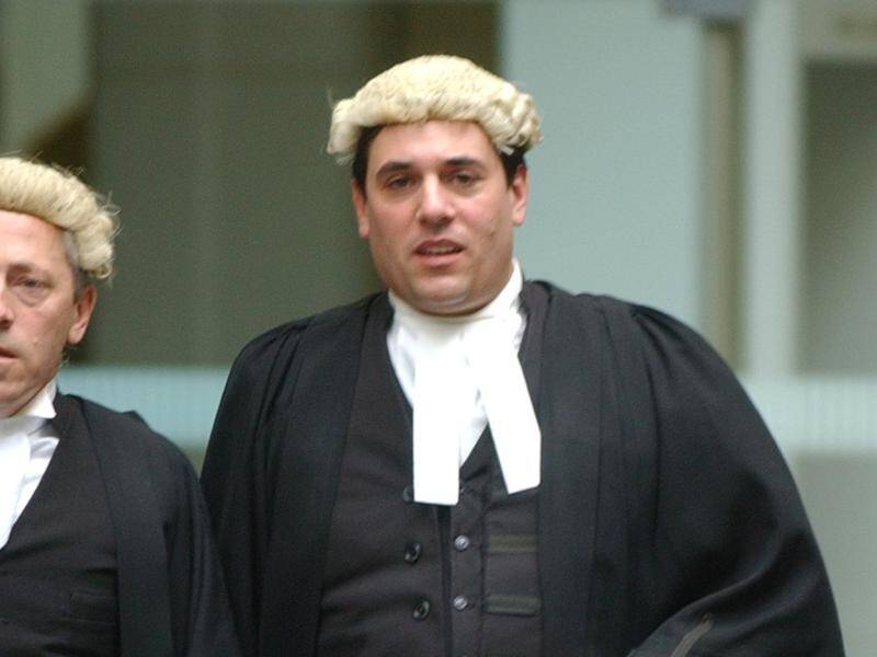 Judge Salvatore Vasta (centre) is being sued by a father he jailed during divorce proceedings.