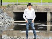 Lord Mayor Gordon Bradbery at the bridge on Swan Street, Wollongong, where the council has improved the water flow after two years of flooding. Picture: SYLVIA LIBER