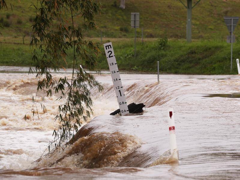 Floods which hit northern NSW and southeast Queensland last year caused $6 billion worth of damage. (JASON O'BRIEN/AAP PHOTOS)