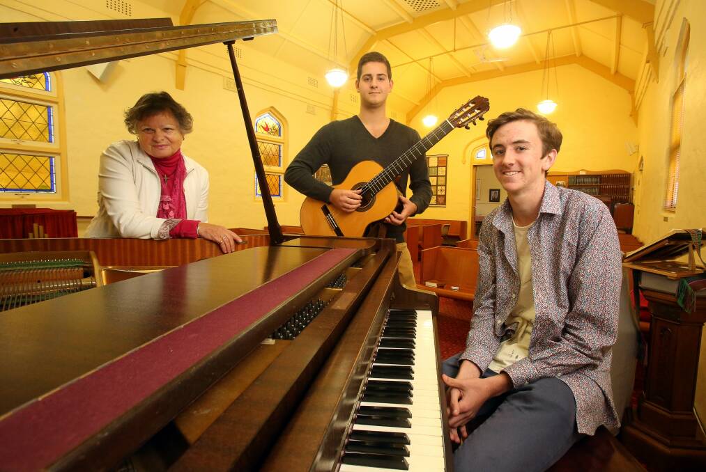 Austinmer Village Chapel minister Roselin Fisher with HSC music students Liam Marino and Felix Smith, who will perform at the chapel on Sunday. Picture: ROBERT PEET