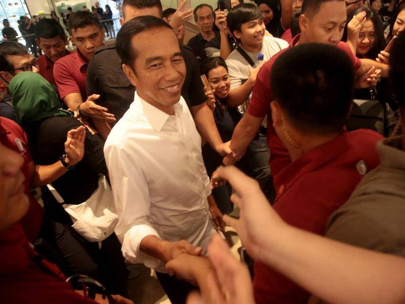 Incumbent president Joko Widodo (C) has won Indonesia's election with a comfortable margin.