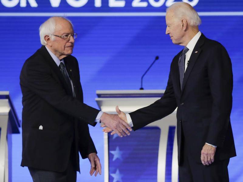 Bernie Sanders (L) may be hurt by the socialism label, fellow presidential contender Joe Biden says.