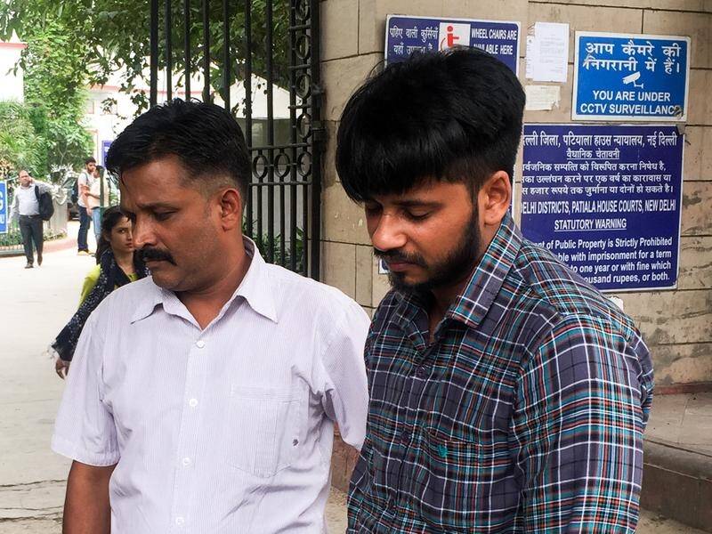 Hit-run driver Puneet Puneet (R) with his uncle outside a court in Delhi.