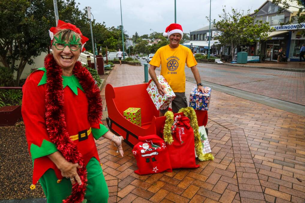 Astrid Quinn and Roger Drury preparing for Gerringong's Street Parade and Market Day. Picture: GEORGIA MATTS