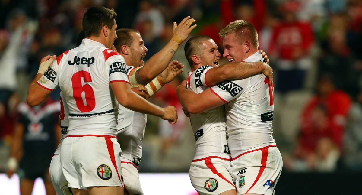 Mike Cooper celebrates scoring a try with Dragons teammate Mitch Rein against the luckless Warriors. Picture: GETTY IMAGES