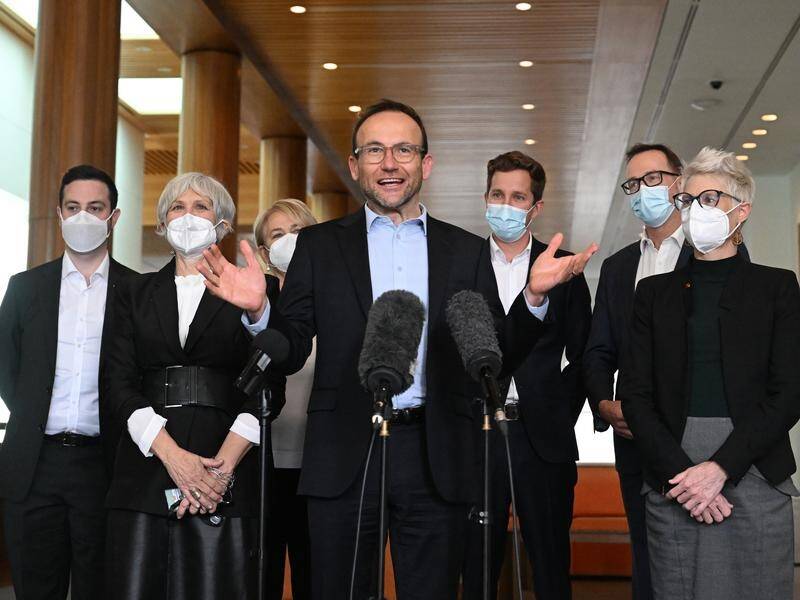 Greens leader Adam Bandt, centre, is pushing for Labor's 2030 emissions target to be increased. (Mick Tsikas/AAP PHOTOS)