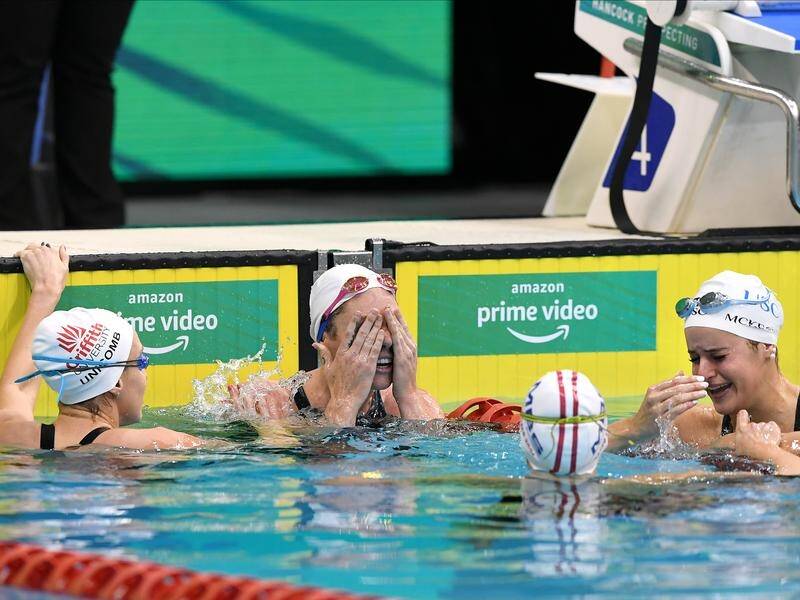 Emily Seebohm (centre) booked her Tokyo ticket after finishing second in the 100m backstroke final.