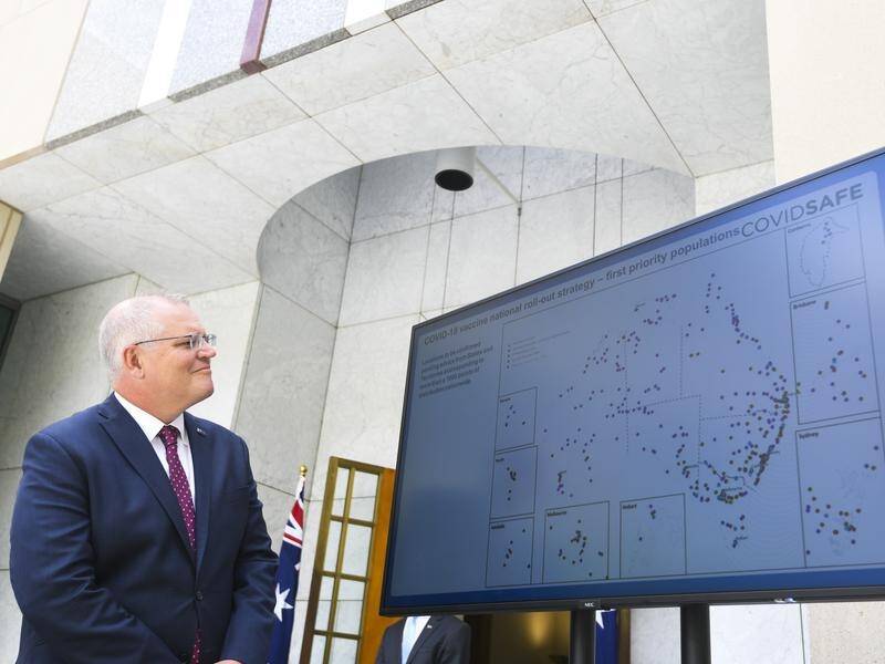Prime Minister Scott Morrison views a map detailing vaccine rollout priorities.