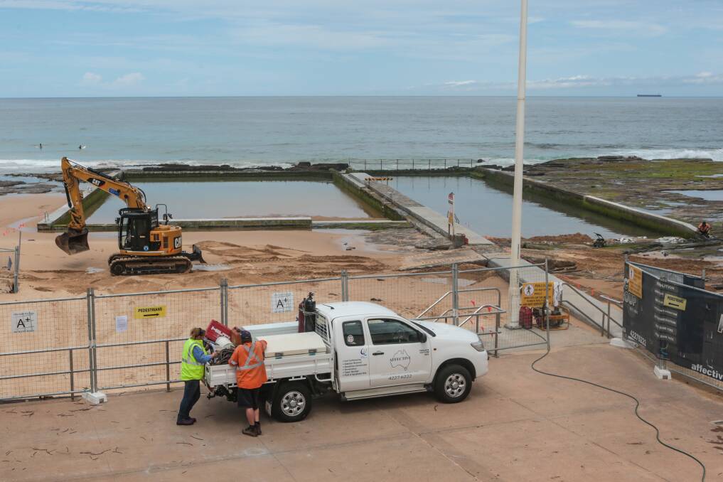 New contractors working on Austinmer's troubled ocean pool. Work was to have been completed in October. Picture: ADAM McLEAN