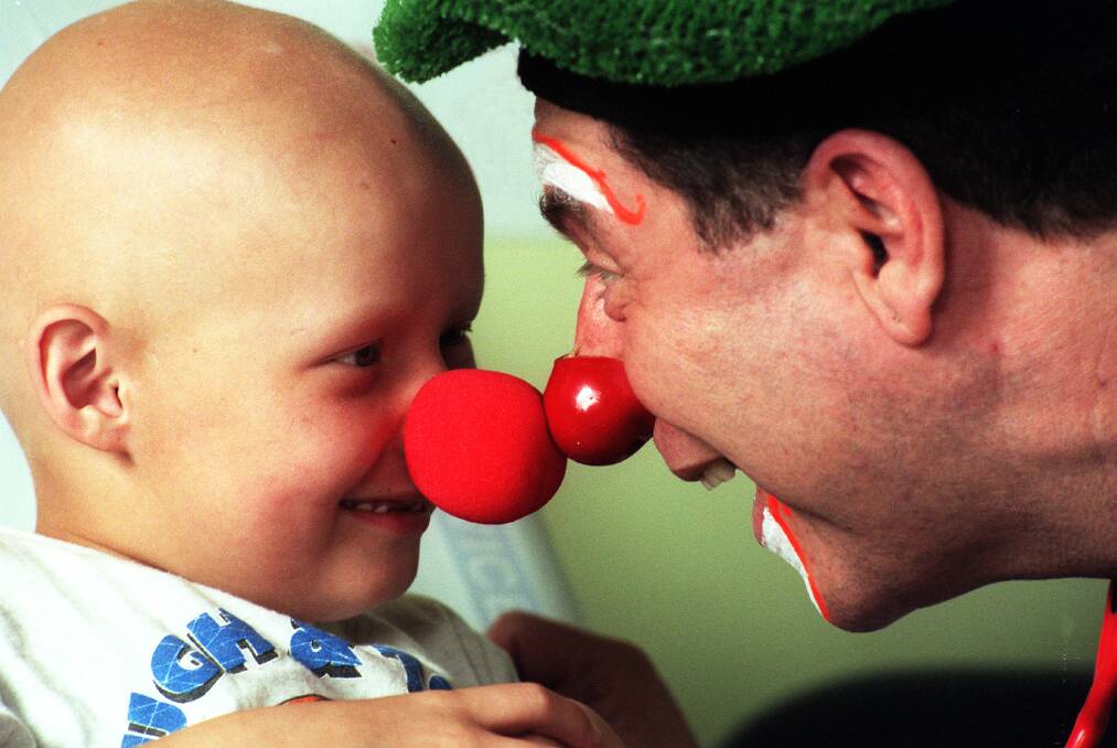 Cancer patient Daimen Zylstra, 6, of Goulburn, goes nose to nose with Dr Peter Spitzer in 1999 (above). 