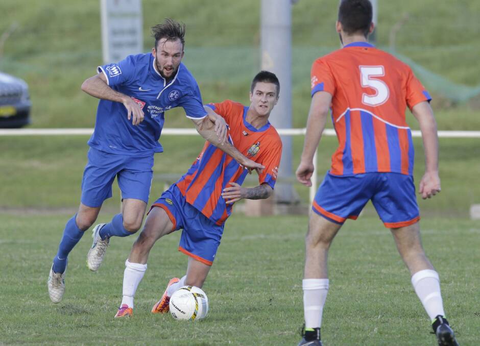 Bulli's Tobin Zoomens beats two defenders as the visitors go on the attack in their 5-1 defeat of previously unbeaten Dapto Dandaloo. Picture: ANDY ZAKELI