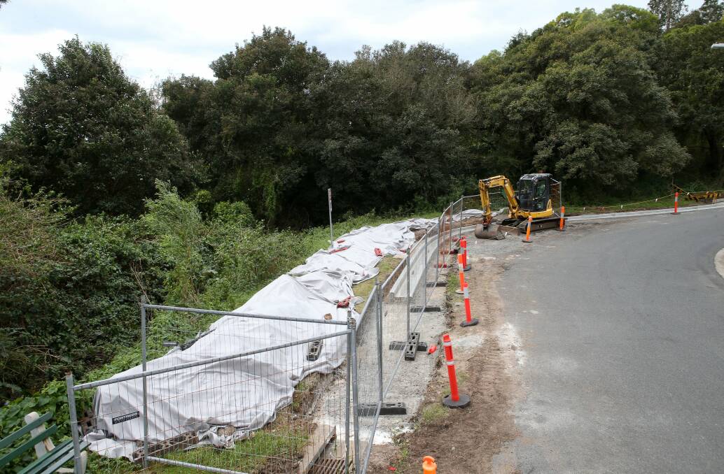 Risky: Material is covered at a Wollongong City Council work site on Sea Foam Avenue, Thirroul. The mounds containing asbestos are to be sealed off. Picture: KIRK GILMOUR
