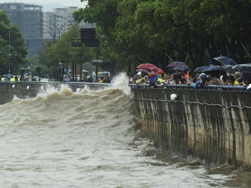 High waters hit the bank of the Qiantang River in Hangzhou ahead of the arrival of Typhoon Muifa. (AP PHOTO)