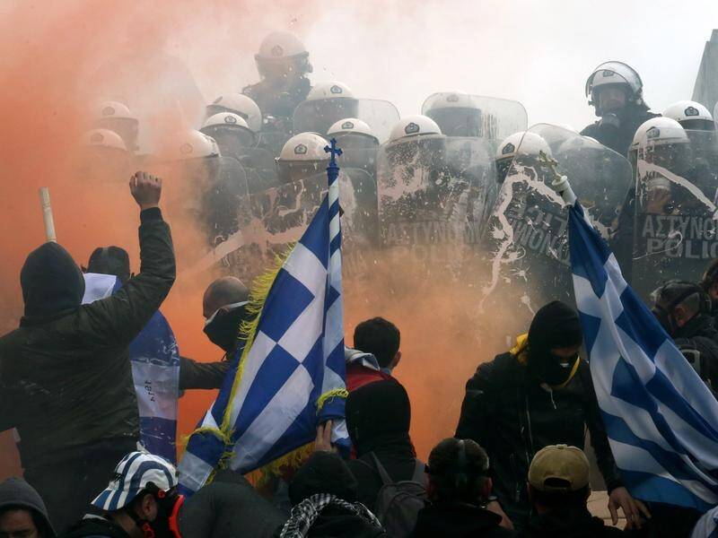 Greeks have clashed with police in Athens as they protested against a Macedonian name deal.