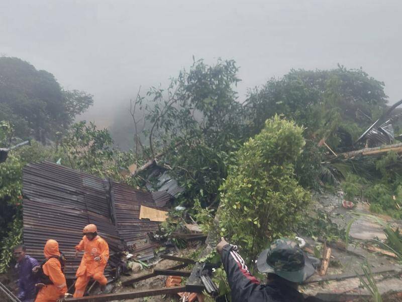 A landslide triggered by torrential rain on Indonesia's Sulawesi Island has claimed 18 lives. (AP PHOTO)