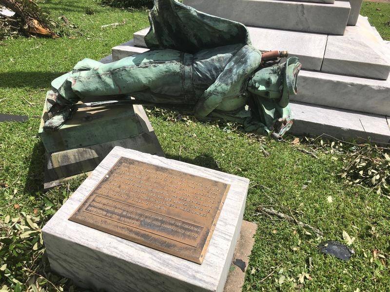 A statue of a Confederate soldier has been torn down as Hurricane Laura ripped through the US coast.