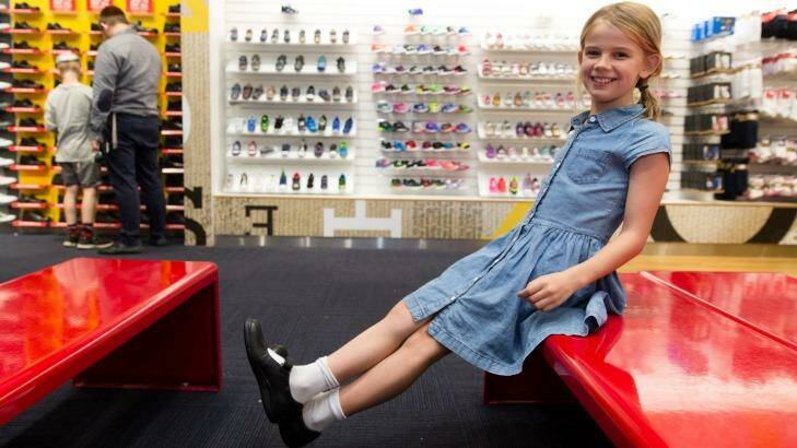 Asha Taylor tries on new school shoes at Shoes & Sox, in Bondi Junction, Sydney. Photo: Janie Barrett
