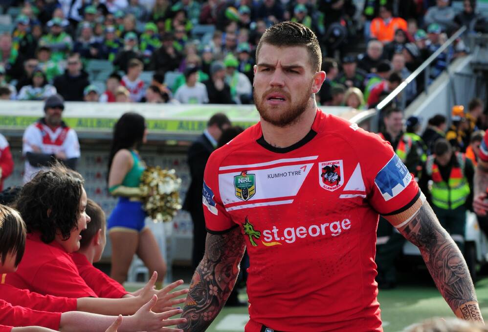 Josh Dugan runs on to GIO Stadium in Canberra for the first time after being sacked by the club early last season. Picture: GRAHAM TIDY