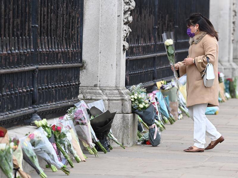 Mourners have laid flowers outside Buckingham Palace after the death of Prince Philip on Friday.