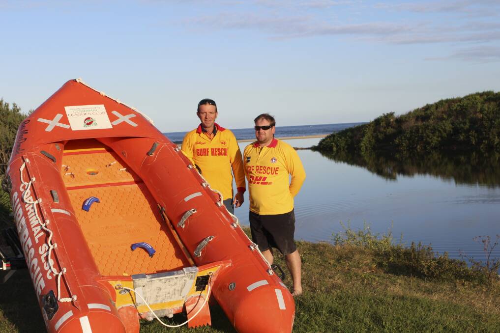 Corrimal SLSC president Tony Cartwright and Power Craft captain Todd Johnston with the much-needed new inflatable boat.