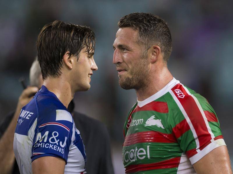 Lachlan Lewis and Sam Burgess engaged in a running battle in the South Sydney-Canterbury NRL match.