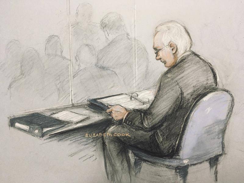 Julian Assange says he is struggling to communicate with his lawyers from the courtroom dock.