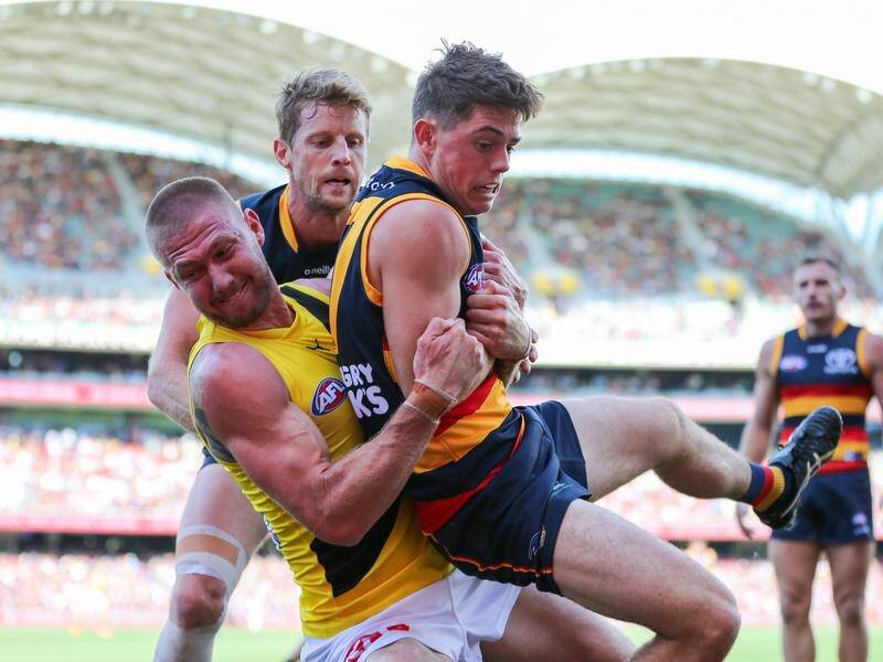 Nathan Broad (left) is facing a minimum three-week AFL ban for his sling tackle on Patrick Parnell. (Matt Turner/AAP PHOTOS)