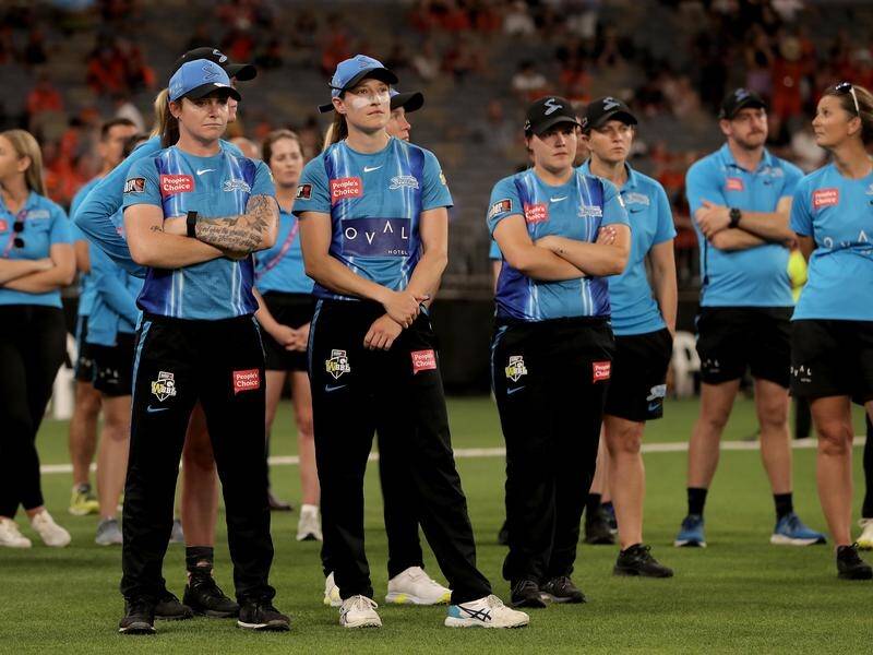 Despondent Adelaide players look on after being defeated in the WBBL final by the Perth Scorchers.