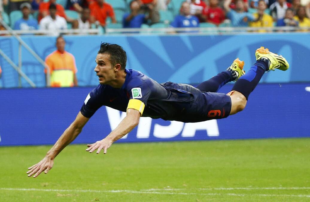 Robin van Persie heads towards goal in the Netherlands clash with Spain. Picture: REUTERS