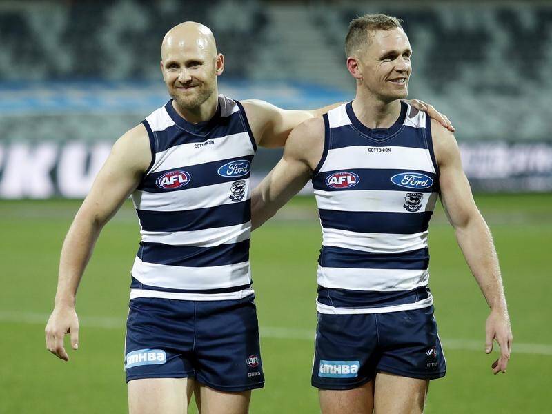 Joel Selwood (r) will return for Geelong against North Melbourne but Gary Ablett is still out.