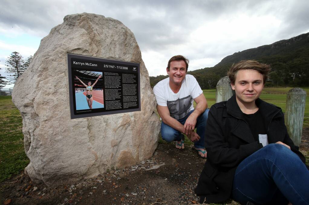 Greg McCann and son Benton at the Wollongong City Council’s new plaque dedicated to his late wife Kerryn. Picture: KIRK GILMOUR