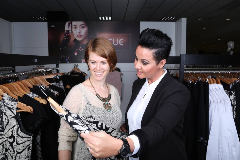 Jade Sardon of Styled by Jade shows Mahlah Grey some of the CUE range in Myer at Stockland Shellharbour. Picture: GREG ELLIS