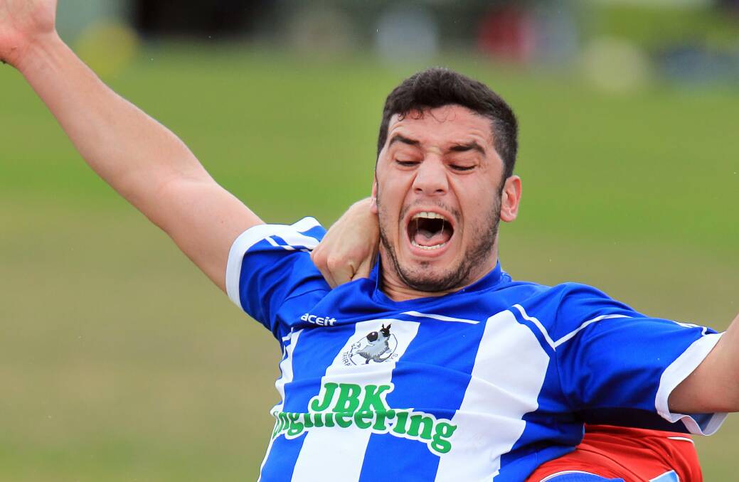 Tarrawanna's Wandi Jajaw shows plenty of emotion as he tangles with an Albion Park opponent at Terry Reserve on Saturday. Picture: SYLVIA LIBER