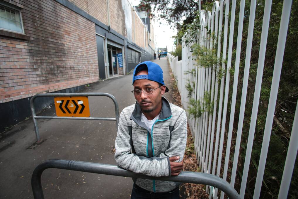 African refugee Tumezghi Tesfay stands in the laneway where he was brutally bashed last year, five days after he arrived in Australia. Picture: ADAM McLEAN