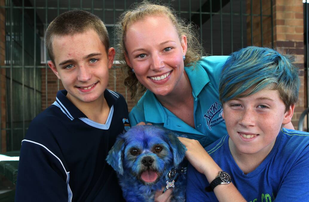 Rhyz Presser, Lisa Craig, Jayden Currey and Costa the dog go blue for autism at Corrimal High School. Picture: GREG TOTMAN