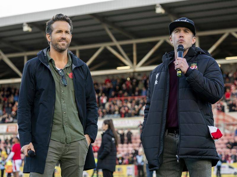 Hollywood duo Ryan Reynolds (left) and Rob McElhenney live for their Welsh soccer club Wrexham AFC. (AP PHOTO)