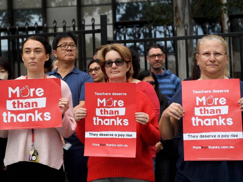 Teachers walked out of a Sydney school as the premier arrived in defiance of a union ban.