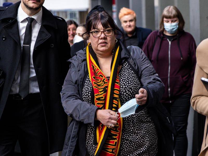 Crystal McKinnon (centre) and another protest leader are accused of breaching COVID-19 directions. (Diego Fedele/AAP PHOTOS)