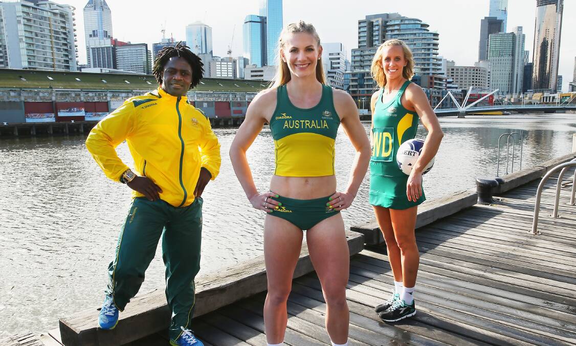 Weightlifter Francois Etoundi, athlete Melissa Breen and netballer Renae Hallinan show off their Glasgow Commonwealth Games uniforms in Melbourne on Monday. Picture: GETTY IMAGES