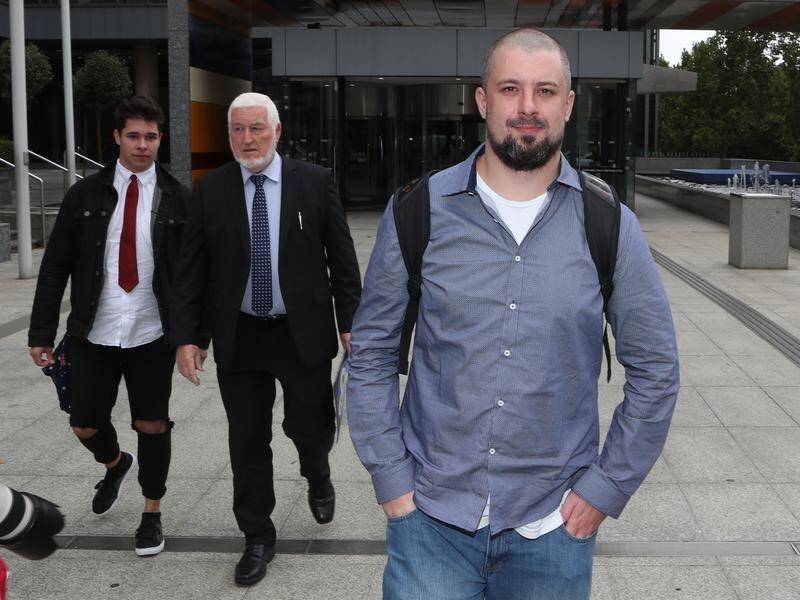 Neil Erikson (right) has been found in contempt of court over a video featuring Sam Dastyari (file).