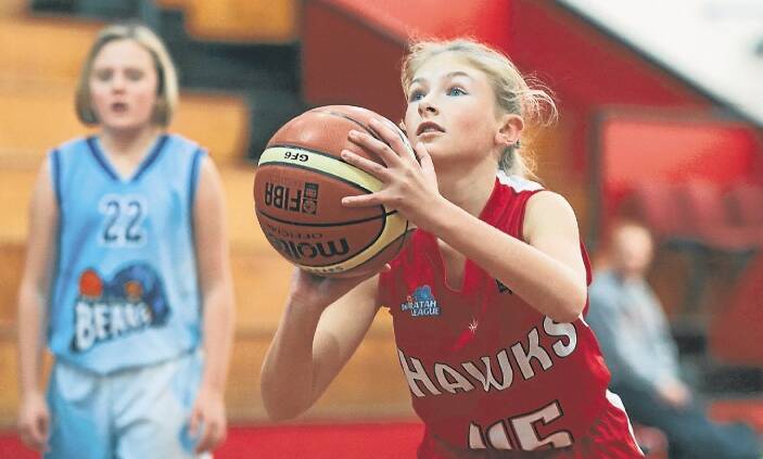 Top shot: Yazmin Cotter takes a free throw during the Illawarra Hawks' under 12s win over Goulburn in round two of the Southern Junior League at the Snakepit. Picture: ADAM McLEAN