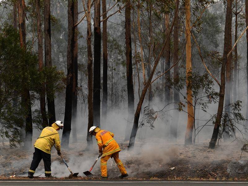 Bushfire containment remains a priority for NSW firefighters as light showers fall on fire grounds.