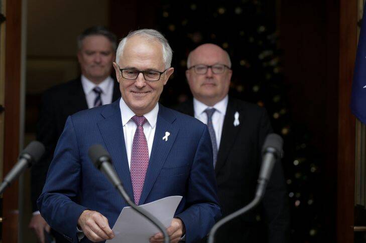 Finance Minister Mathias Cormann, Prime Minister Malcolm Turnbull and Attorney-General George Brandis address the media during a joint press conference at Parliament House in Canberra on  Tuesday 5 December 2017. fedpol Photo: Alex Ellinghausen